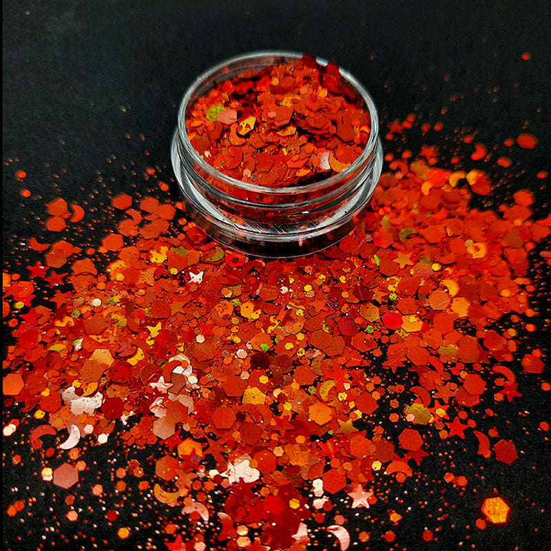 Star + Moon Nail Glitter, Burnt Orange. An incredibley shiny nail glitter of stars, crescent moons and mixed size hexagons in a sparkly powder.
