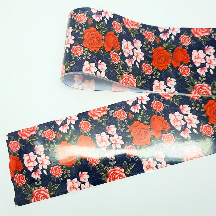 Floral-patterned nail foil with red and pink flowers on a blue background