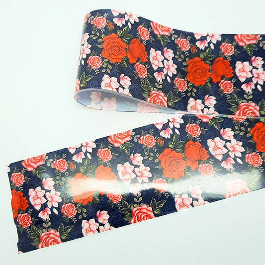 Floral-patterned nail foil with red and pink flowers on a blue background